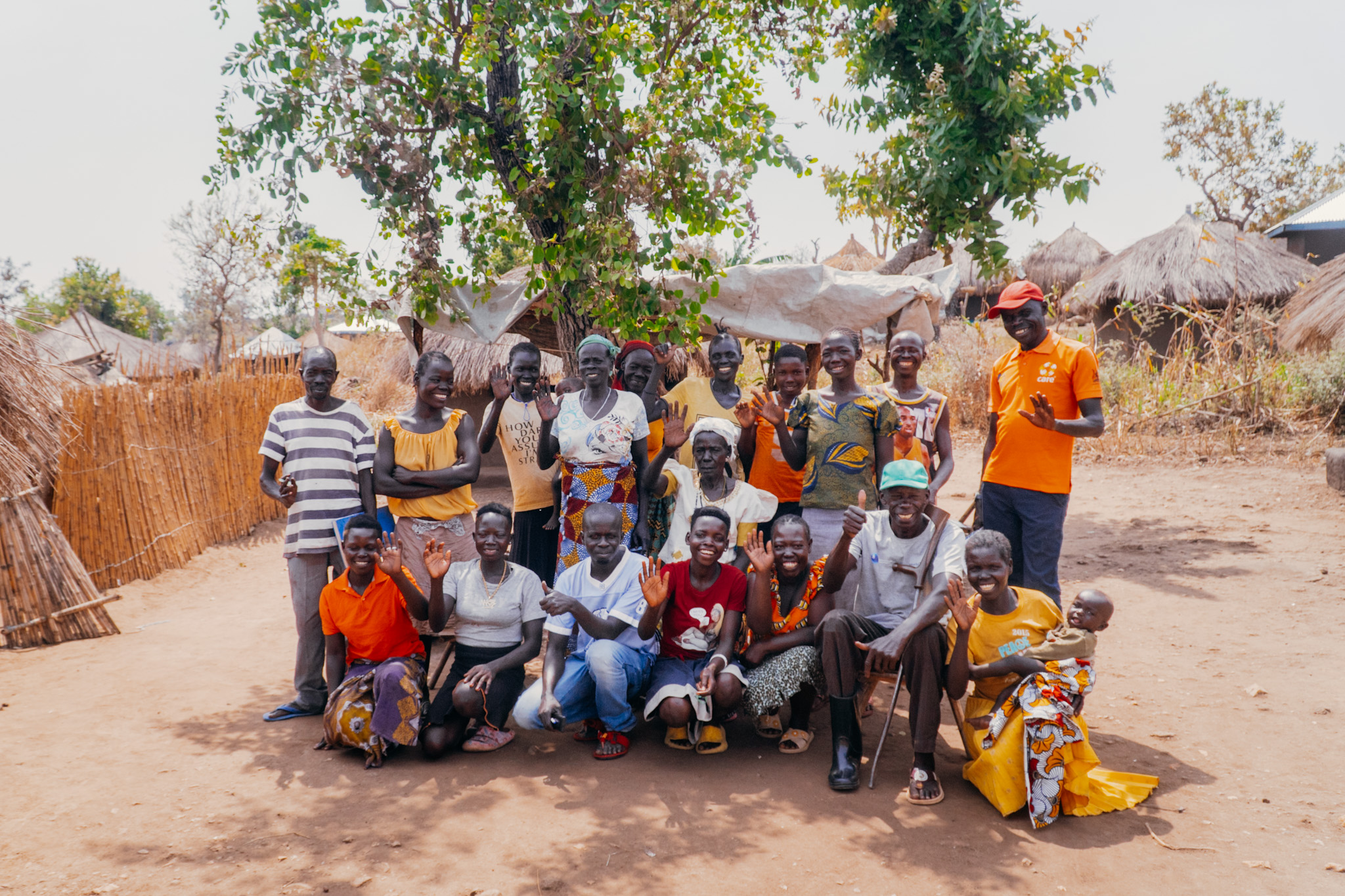 Members of GIGA in Omugo refugee camp pose for photo after their weekly savings. Photo_ Jamie Intwari